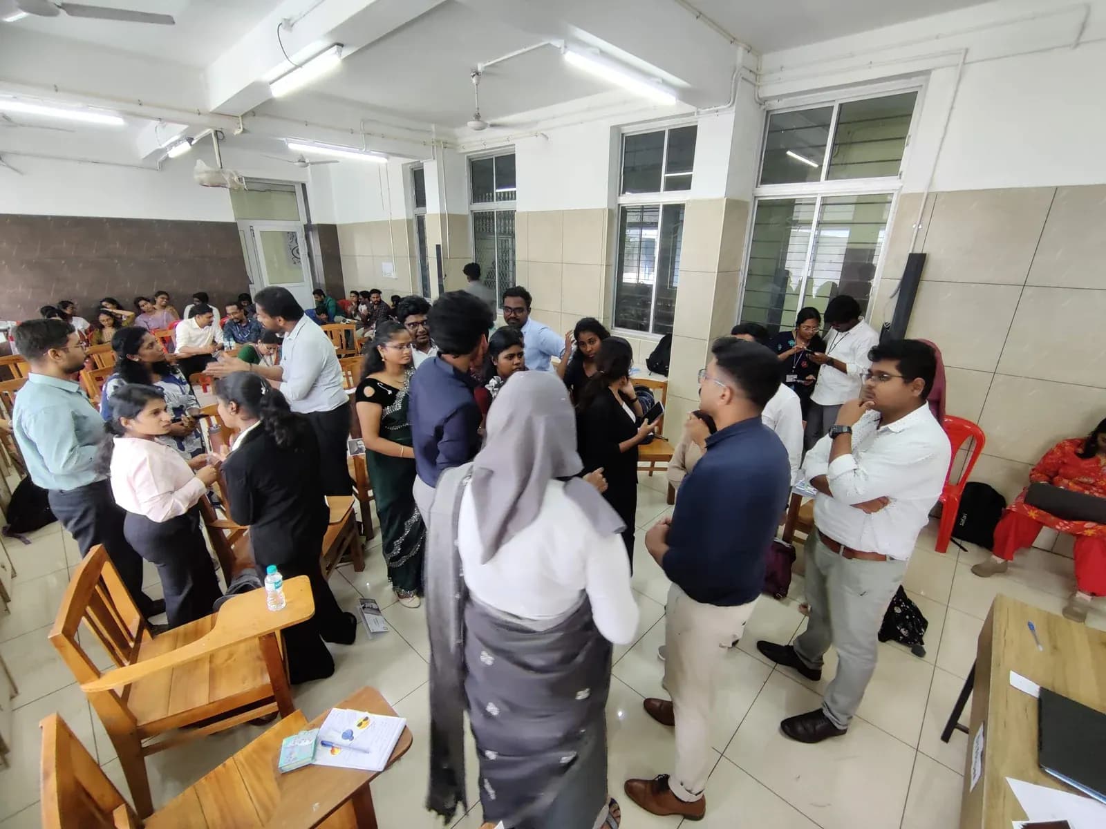 Delegates in formal attire at DIIMUN conference floor